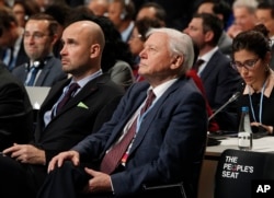 Natural historian Sir David Attenborough, second right, listens to speeches during the opening of COP24 UN Climate Change Conference 2018 in Katowice, Poland, Dec. 3, 2018.