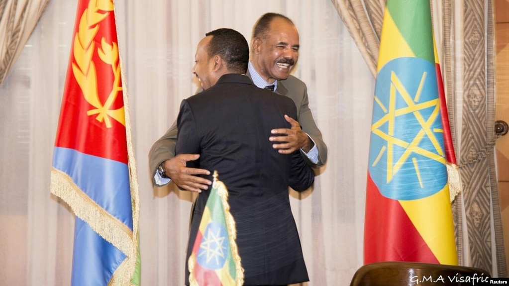 Ethiopian Prime Minister Abiy Ahmed and Eritrean President Isaias Afwerk embrace at the declaration signing in Asmara, Eritrea, July 9, 2018, in this photo obtained from social media. (Ghideon Musa Aron Visafric/via Reuters)