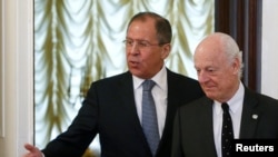 Russian Foreign Minister Sergei Lavrov (L) shows the way to United Nations special envoy on Syria Staffan de Mistura during a meeting in Moscow, Russia, May 3, 2016. 
