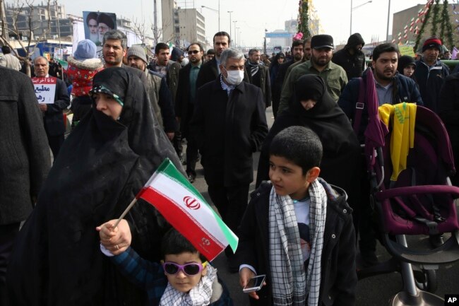 Commander of Iran's Revolutionary Guard Gen. Mohammad Ali Jafari, center, attends an annual rally commemorating the anniversary of the 1979 Islamic revolution, which toppled the late pro-U.S. Shah, Mohammad Reza Pahlavi, in Tehran, Feb. 10, 2017.