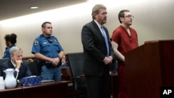 Colorado theater shooter James Holmes (right) appears in court with his attorney Daniel King to be formally sentenced as Prosecutor George Brauchler looks on, in Centennial, Colorado, Aug. 26, 2015.