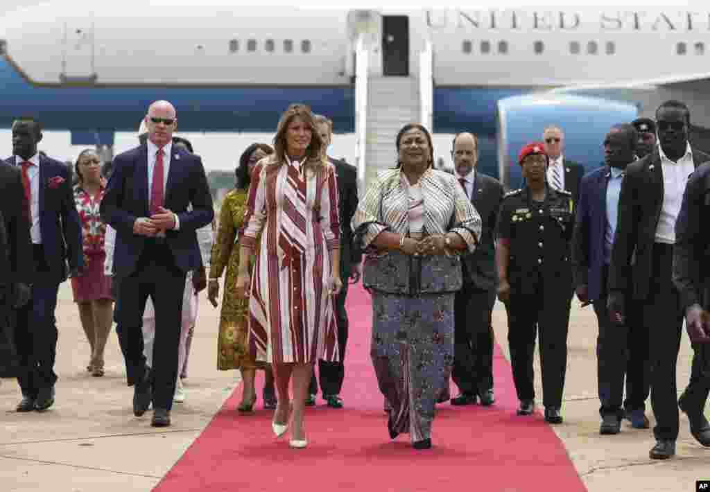First lady Melania Trump walks with Ghana's first lady Rebecca Akufo-Addo as she arrives at Kotoka International Airport in Accra, Ghana, Oct. 2, 2018. 