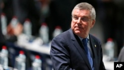 IOC President Thomas Bach waits for the beginning of the extraordinary FIFA congress in Zurich, Switzerland, Feb. 26, 2016. In a major change in the handling of positive drug tests at the Olympics, the IOC is set to remove itself from the process.