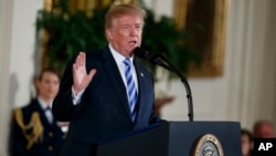 President Donald Trump speaks during the Public Safety Medal of Valor awards ceremony in the East Room of the White House, Feb. 20, 2018, in Washington.