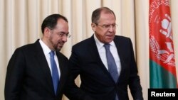 Russian Foreign Minister Sergei Lavrov and his Afghan counterpart Salahuddin Rabbani arrive for a joint news conference following their meeting in Moscow, Russia, Feb. 7, 2017. Russia has hinted at involving the U.S. in a new regional dialogue on Afghanistan.