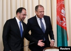 FILE - Russian Foreign Minister Sergei Lavrov and his Afghan counterpart Salahuddin Rabbani arrive for a joint news conference following their meeting in Moscow, Russia, Feb. 7, 2017.