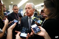 Sen. Bob Corker, R-Tenn., speaks to reporters while heading to vote on budget amendments, Oct. 19, 2017, in Washington.