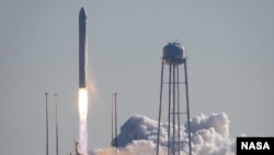 The Antares rocket carrying the Cygnus cargo spacecraft launches from NASA's Wallops Flight Facility in Virginia, Jan. 9. 2014.