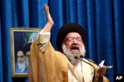 Iranian senior cleric Ahmad Khatami delivers his sermon during Friday prayer ceremony in Tehran, Iran, Jan. 5, 2018.
