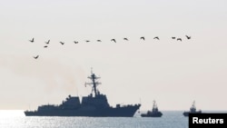 FILE - The USS Truxtun, a U.S. guided-missile destroyer, enters the Black Sea port of Varna, Bulgaria, March 13, 2014.
