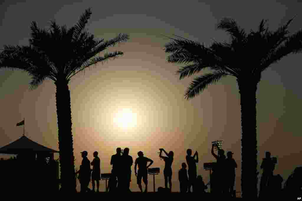 Spectators watch the second free practice at the Yas Marina racetrack in Abu Dhabi, United Arab Emirates, Nov. 1, 2013. The Emirates Formula One Grand Prix will take place on Nov. 3.