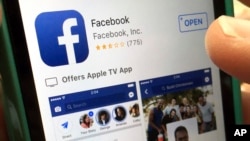 In this Monday, June 19, 2017, file photo, a user gets ready to launch Facebook on an iPhone, in North Andover, Mass. Facebook’s efforts to reduce the spread of fake news using outside fact-checkers may be working, but with a big caveat. The company says once a story receives a “false rating” from a fact-checker, Facebook is able to reduce future impressions of it by 80 percent. But it regularly takes more than three days for a story to receive a false rating. And, the way news stories work, most impressions happen when the story first comes out, not three days later. (AP Photo/Elise Amendola, File)