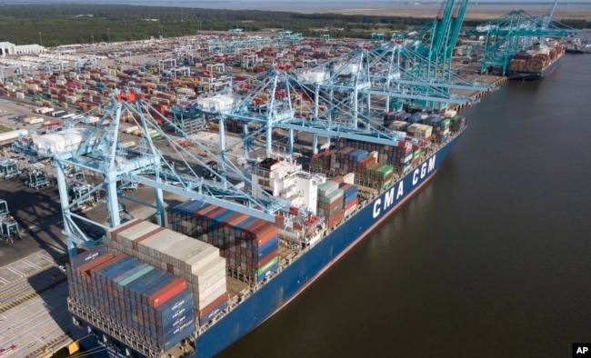 A container ship is unloaded at the Virginia International Gateway terminal in Norfolk, Va., May 10, 2019.