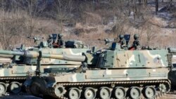 South Korean army soldiers ride K-9 self-propelled howitzers in Paju, South Korea, near the border with North Korea, Jan. 11, 2022.