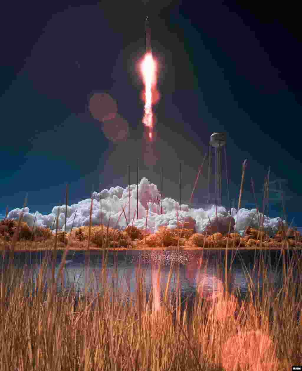 The Orbital Sciences Corporation Antares rocket, with the Cygnus cargo spacecraft aboard, is seen in this false color infrared image, as it launches from Pad-0A of the Mid-Atlantic Regional Spaceport (MARS), NASA Wallops Flight Facility, Virginia, USA, Sept. 18, 2013.