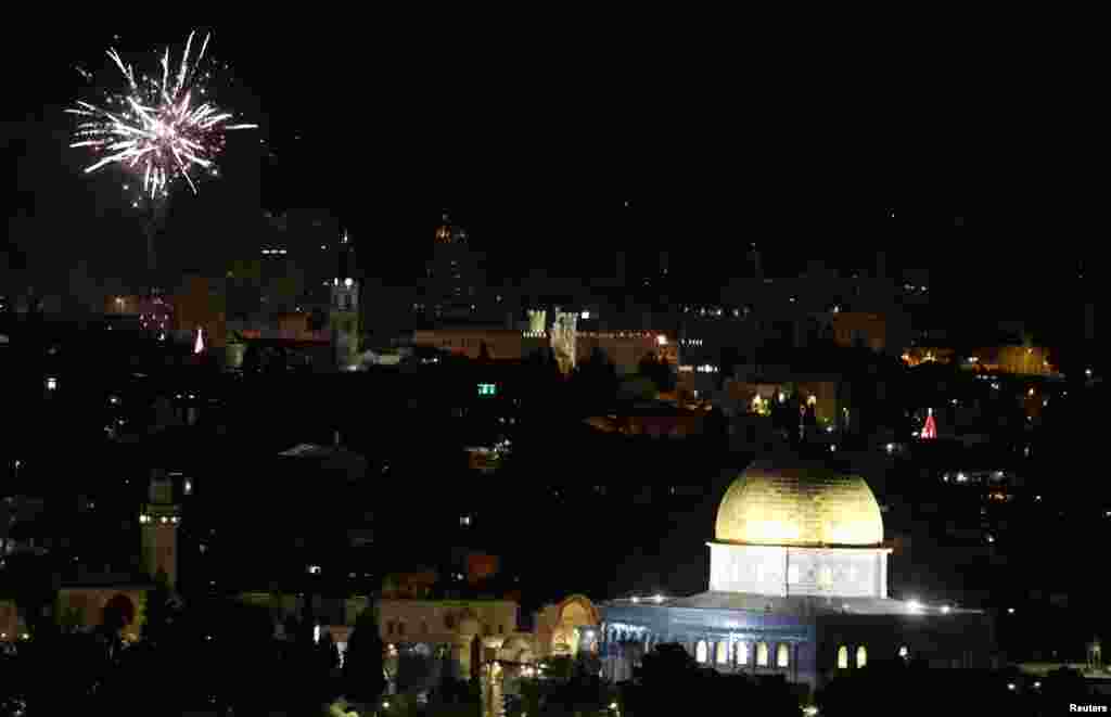 Fireworks light up the sky over Jerusalem's Old City during New Year's celebrations, Jan. 1, 2019. 