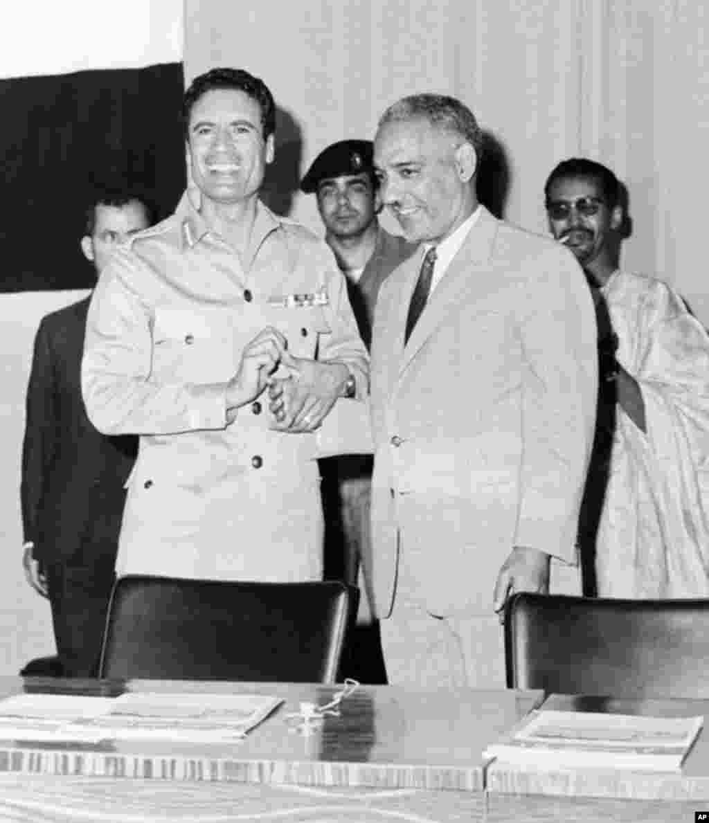 In this1969 picture of Libyan Head of State Colonel Moammar Gadhafi (L) shaking hands in Tripoli with the President of Mauritania (1961-78), Mokhtar Ould Daddah, (AFP).