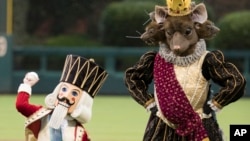 The Prince and Mouse King from the Nutcracker throw out the first pitch prior to the first inning of a baseball game between the Houston Astros and the Philadelphia Phillies, July 25, 2017.