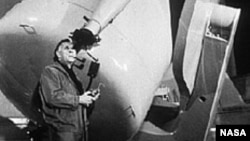 Edwin Hubble looks through a guidescope of the 1.2 meter telescope at the Palomar Observatory in California.