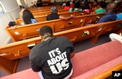 A woman listens to Black Voters Matter co-founder LaTosha Brown speak at a church as part of The South Is Rising Tour 2018, Aug. 22, 2018, in Warner Robins, Ga.