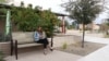 French international student Emma Seguy sits outside at the Mesa Community College campus in Mesa, Arizona.