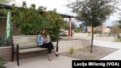 French international student Emma Seguy sits outside at the Mesa Community College campus in Mesa, Arizona.