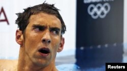 Michael Phelps of the U.S. reacts after finishing in fourth place in the men's 400m individual medley during the London 2012 Olympic Games at the Aquatics Centre July 28, 2012. REUTERS/Michael Dalder (BRITAIN - Tags: SPORT OLYMPICS SPORT SWIMMING) 