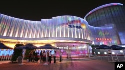 The China Private Enterprise Pavilion is seen at night at the Shanghai World Expo Monday May 3, 2010 in Shanghai, China.