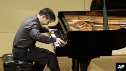 Christopher Shih, a physician from Maryland, competes in the semi-final round of the sixth International Piano Competition for Outstanding Amateurs hosted by the Van Cliburn Foundation in Fort Worth, Texas, May 28, 2011.