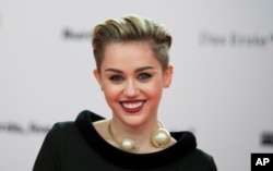 Singer Miley Cyrus arrives for the Bambi 2013 media awards in Berlin, Germany, Nov. 14, 2013.