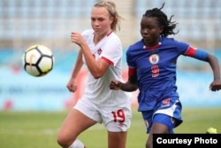 Midfielder Sherly Jeudi, right, in action during the U-20 third-place match at the CONCACAF Women's Under-20 Championship, held in Couva, Trinidad and Tobago, Jan. 28, 2018. (FHF photo)