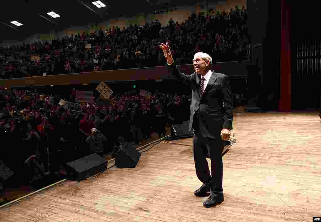 Republican presidential candidate Ron Paul waves after speaking at Michigan State University during a rally in East Lansing on February 27, 2012. (AP)