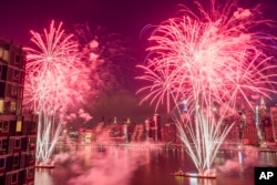 FILE - With the New York City skyline in the background fireworks explode during an Independence Day show over the East River in New York, in this Tuesday, July 4, 2017, file photo. (AP Photo/Andres Kudacki, File)