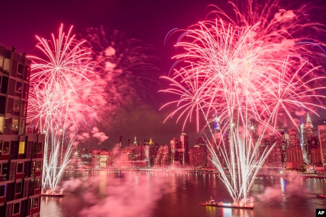 FILE - With the New York City skyline in the background fireworks explode during an Independence Day show over the East River in New York, in this Tuesday, July 4, 2017, file photo. (AP Photo/Andres Kudacki, File)