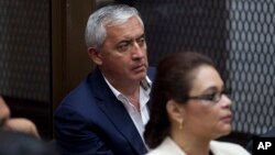 FILE - Guatemala's former President Otto Perez Molina, and his former Vice President Roxana Baldetti, listen during their court hearing in Guatemala City, May 6, 2016.