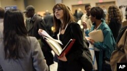 American women have passed men in gaining advanced college degrees as well as bachelor's degrees. New research says well-educated women are also no longer paying a "marriage penalty." (AP Photo/Seth Wenig, File)