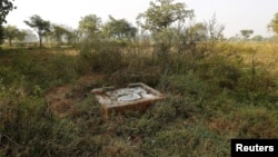 FILE - An open toilet is seen in a field in Gorba in the eastern Indian state of Chhattisgarh, India, Nov. 16, 2015.