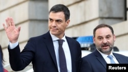 Spain's Socialist leader Pedro Sanchez waves as he arrives at Parliament to attend the final day of a motion of no confidence debate in Madrid, June 1, 2018.