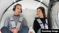 Virgin Hyperloop executives Josh Giegel, its Chief Technology Officer, and Sara Luchian, Director of Passenger Experience, were the first passengers to ride the transportation system during a recent test at the company's DevLoop test site in Las Vegas, Ne