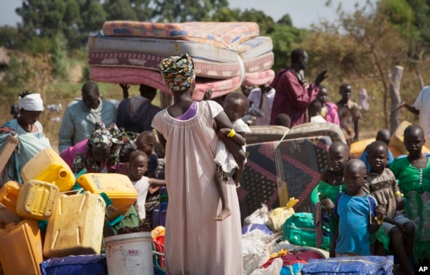 FILE - Refugees arrive in Uganda after fleeing violence in South Sudan, Jan. 6 2014.