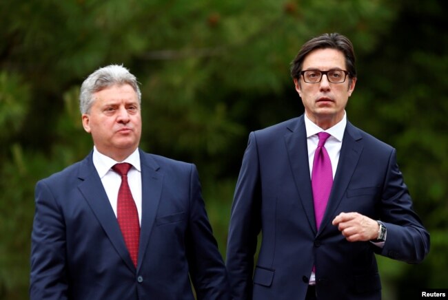 Newly elected President of North Macedonia Stevo Pendarovski walks with outgoing president Gjorge Ivanov, during his inauguration ceremony in Skopje, North Macedonia, May 12, 2019.