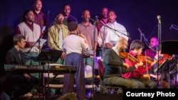 Teaching artist Sarah Elizabeth Charles conducts the Musical Connections Resident Ensemble at Sing Sing Correctional Facility, Dec. 18, 2015. (Photo by Stephanie Berger)