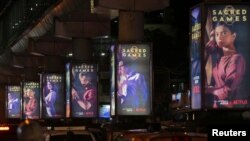 Traffic moves on a road past hoardings of Netflix's new television series "Sacred Games" in Mumbai, India, July 11, 2018. (REUTERS/Francis Mascarenhas)