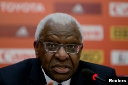 FILE - Lamine Diack speaks during a press conference at the IAAF Congress at the National Convention Center in Beijing, Aug. 20, 2015.