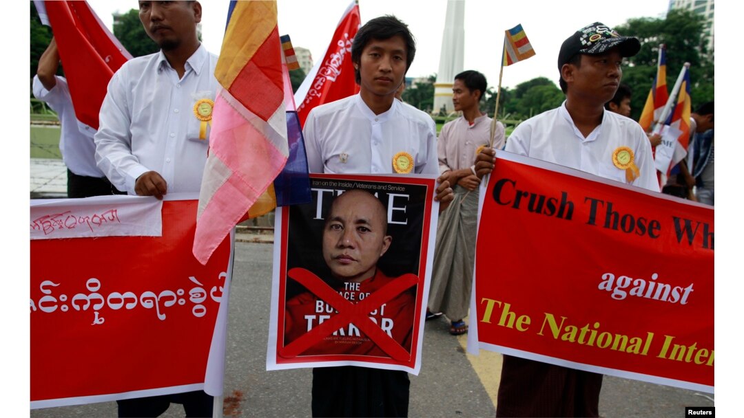 FILE - People demonstrate against Time magazine in Yangon June 30, 2013 when its cover story dubbed radical Buddhist monk U Wirathu, "The Face of Buddhist Terror".