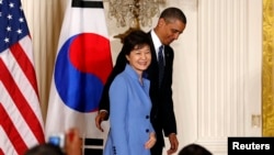U.S. President Barack Obama and South Korea's President Park Geun-hye depart a joint news conference at the White House in Washington, May 7, 2013.