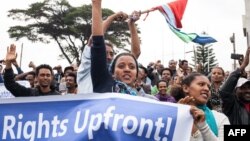 FILE - Eritrean exiles rally in front of the African Union headquarters, responding to a U.N. report highlighting human rights violations in Eritrea, in Addis Ababa, Ethiopia, June 26, 2015.