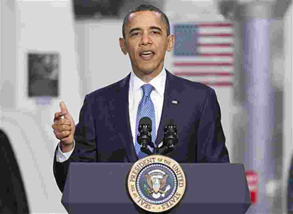 President Barack Obama gestures while speaking at a UPS facility in Landover, Maryland, April 1, 2011