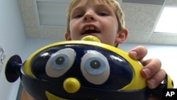 Cosmobot has made speech therapy fun for Kevin Fitzgerald, 6. He has developmental dyspraxia, a condition which makes it difficult for him to move his mouth and tongue.