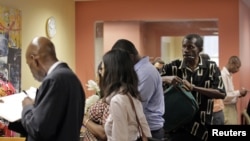 People wait in line to meet with job counselor during a job fair at Workforce1 in New York, September 6, 2012. 